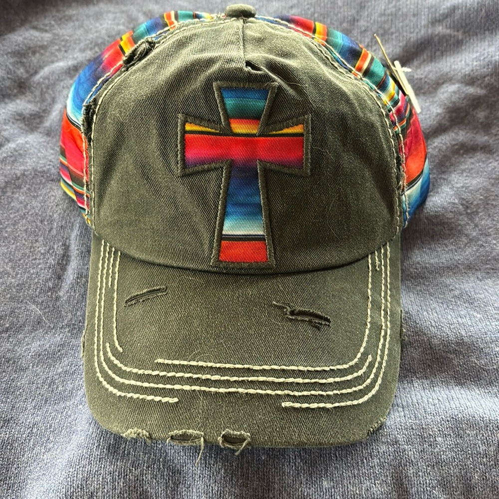Cute baseball hat gray with serape stripes on side and cross on front.